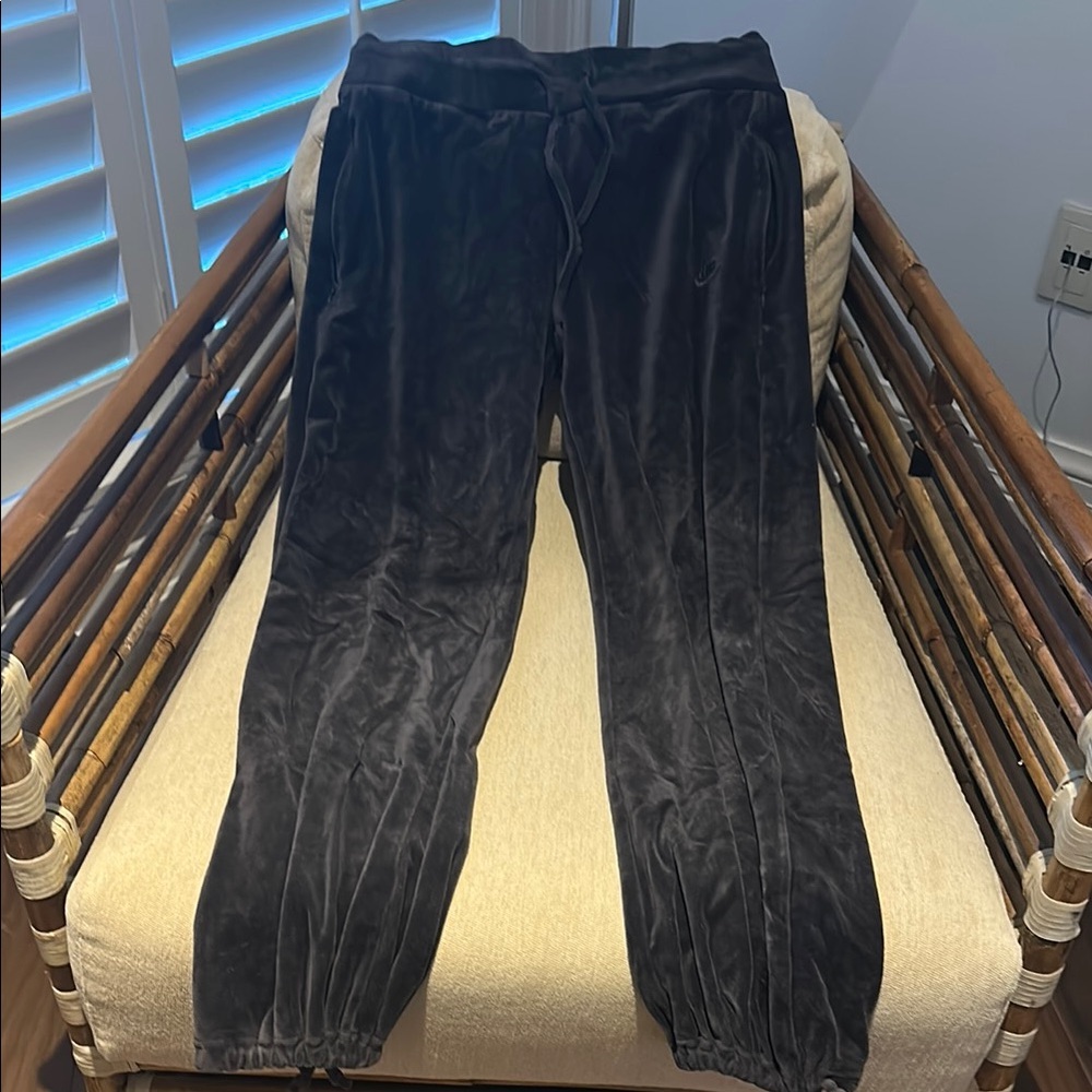 Woman’s Nike Velvety Pants with pockets and tie detail at bottom